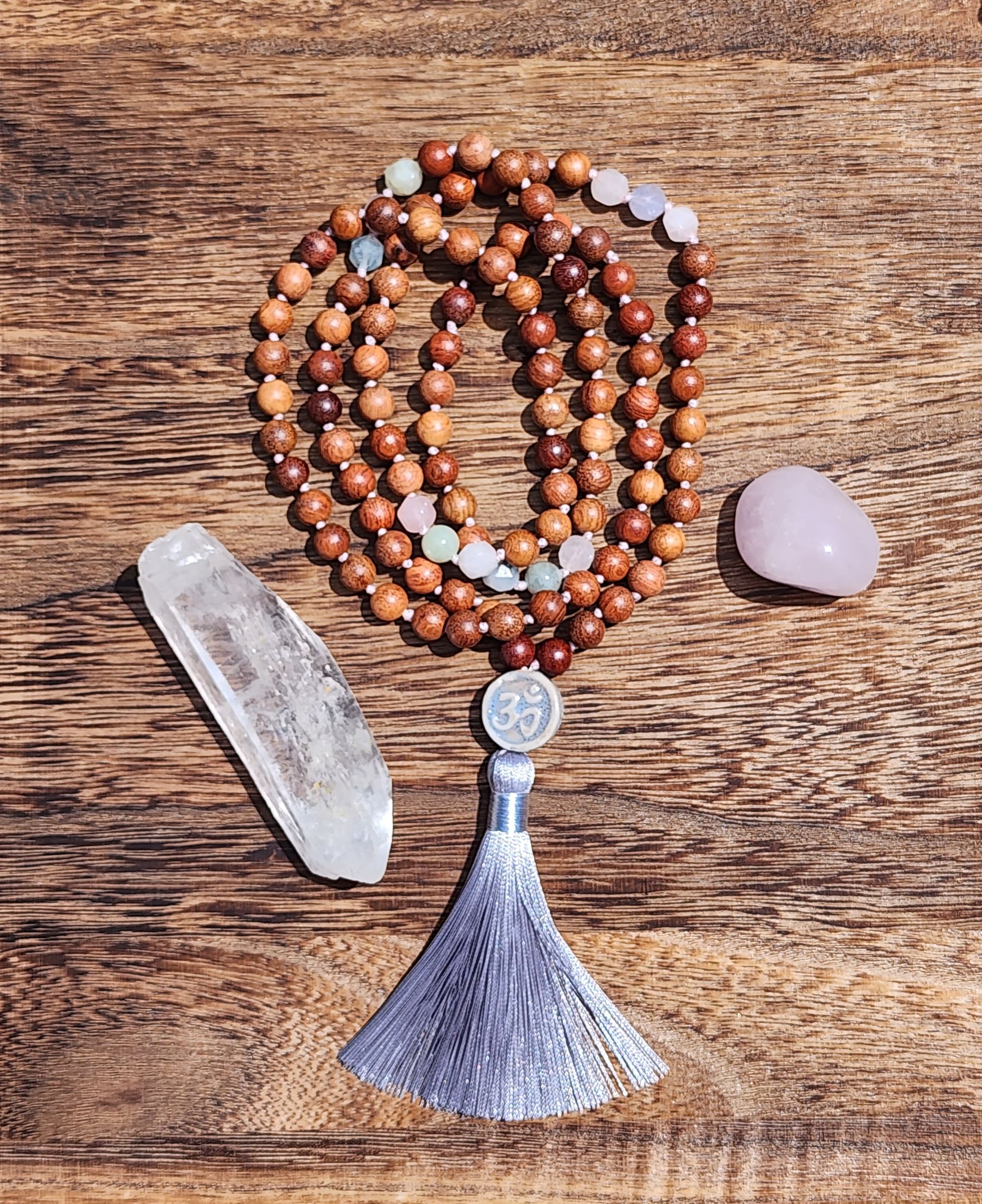 Hand Knotted Morganite Mala featuring olive wood, Om bead, and silver tassel