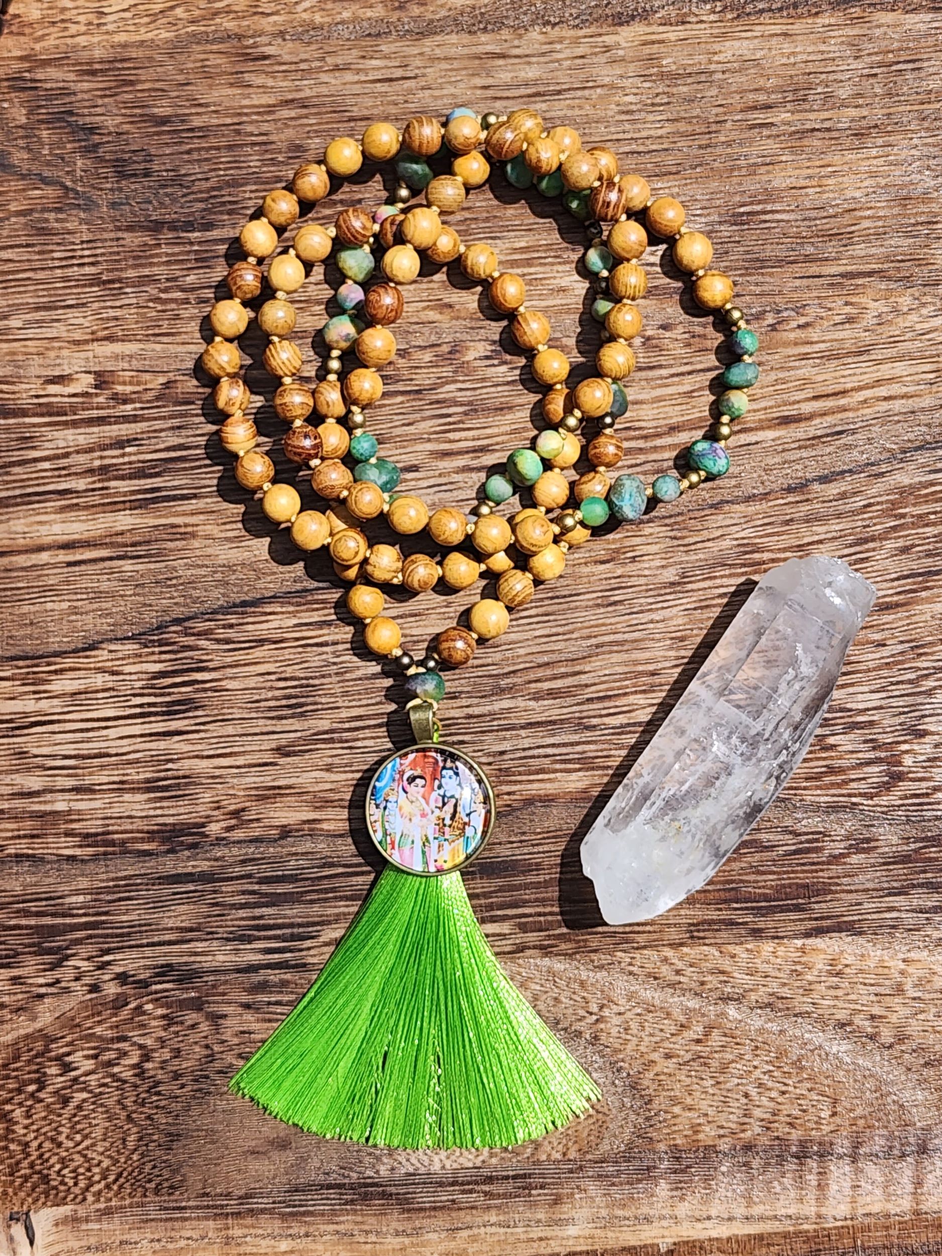 Hand Knotted Green Kyanite Mala featuring olive wood, Shiva & Parvati cabochon, and green tassel